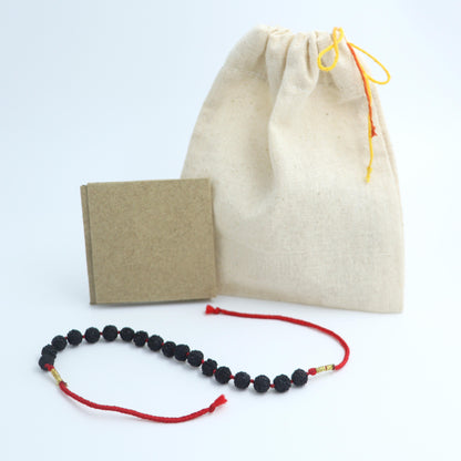 Black Rudraksha Rakhi With Rori & Chawal Tika